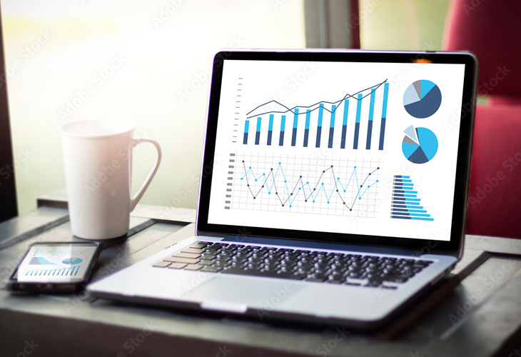 Laptop with charts on screen