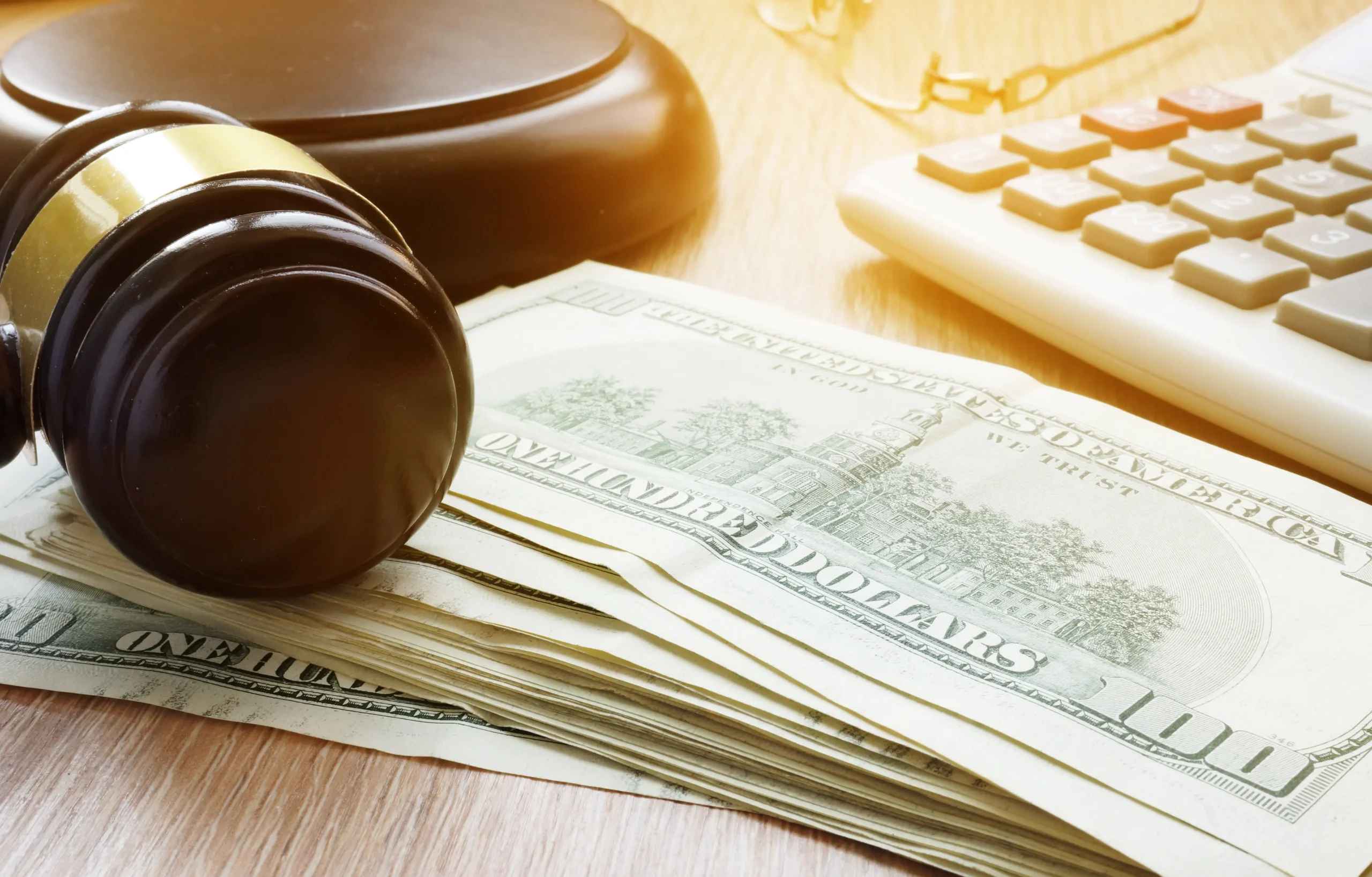 gavel on top of money usd